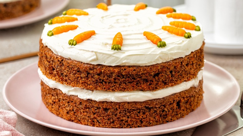 A decorated carrot cake on a plate