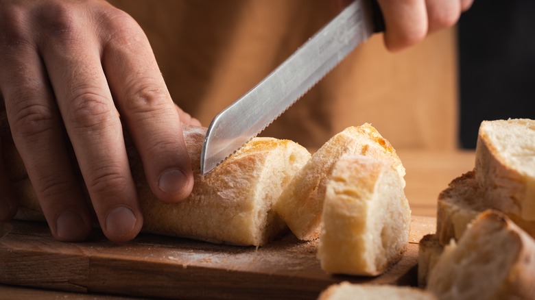 serrated knife slicing bread