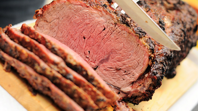 Prime rib roast being carved.