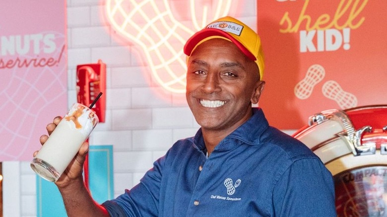 Marcus Samuelsson smiling with peanut shake at pop-up