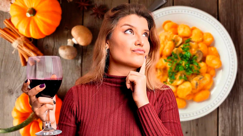 woman with wine and pumpkin pasta