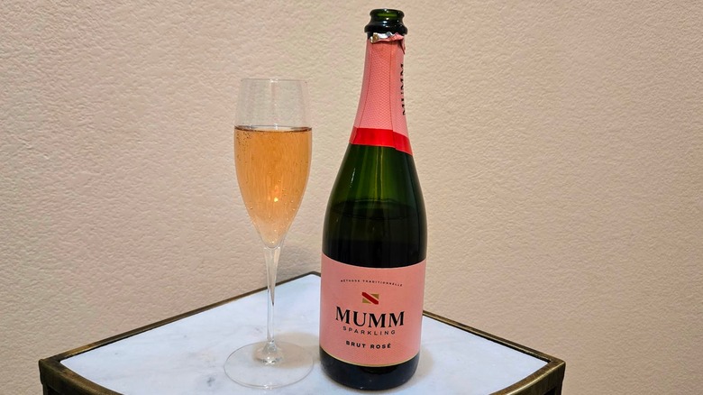Bottle and glass of Mumm Sparkling brut rose