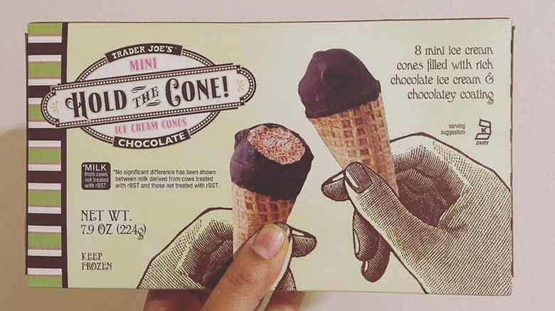 hand holding Hold the Cone box