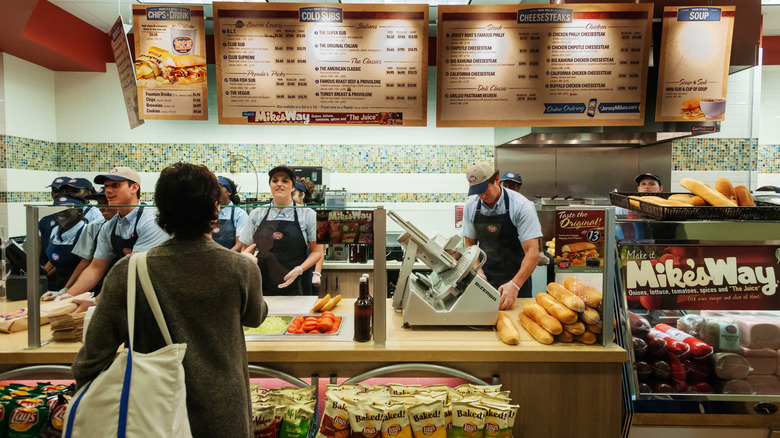 Customer ordering at the counter of Jersey Mike's