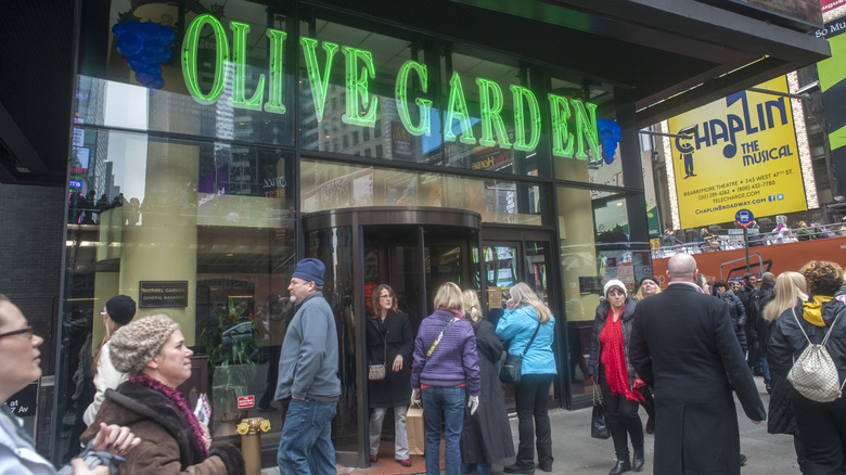 Customers waiting outside Olive Garden