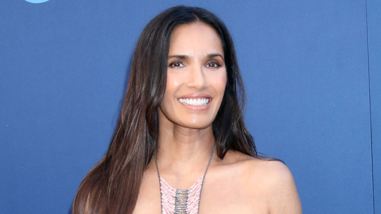 Padma Lakshmi smiling while looking at the camera