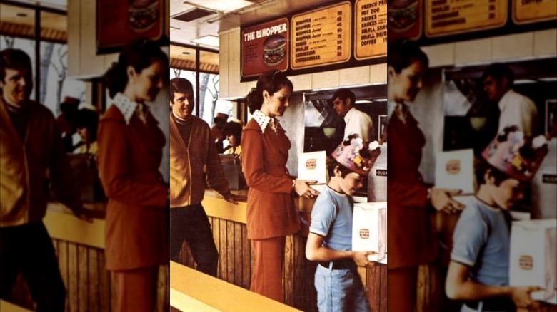 Mirrored image of family ordering at Burger King in 1970s
