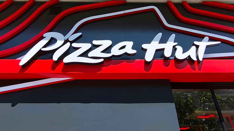 close up of pizza hut sign on restaurant