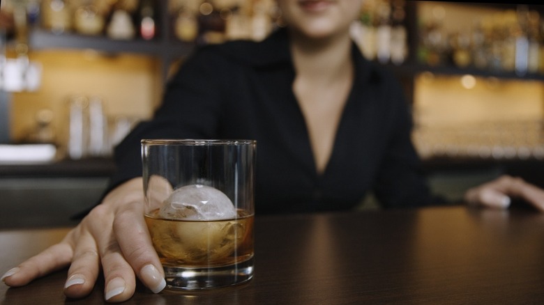 female bartender whiskey