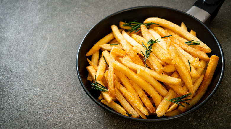 homemade french fries in frying pan