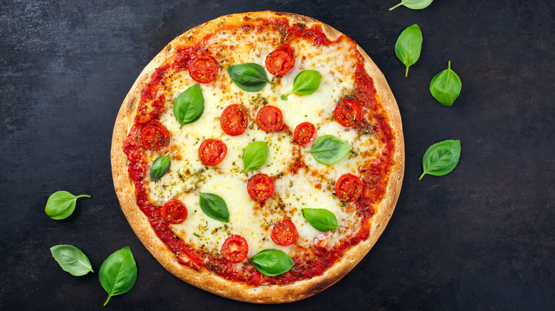 Traditional pizza margherita with tomatoes and mozzarella