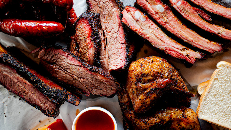A spread of barbecued meats, including brisket, sausage and chicken