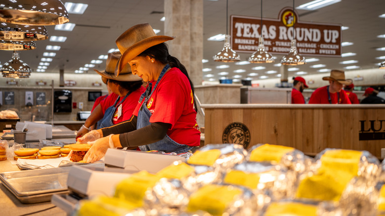 Buc-ee's employees chopping brisket sandwiches