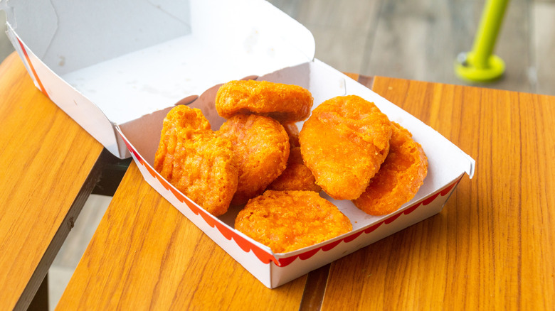 Open McDonald's box with McNuggets on a table