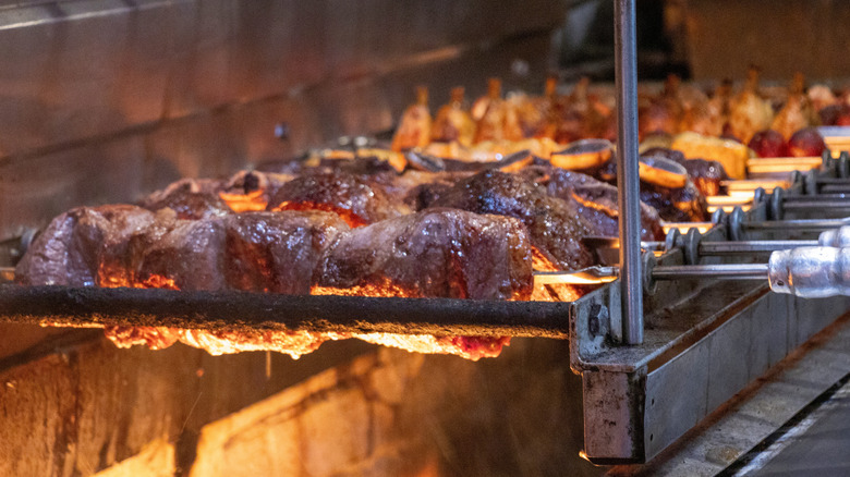 Beef grilling at Brazilian steakhouse