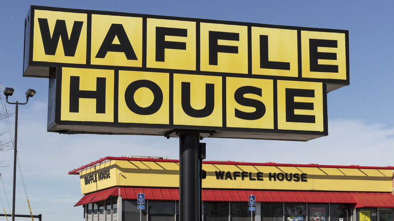 waffle house sign in front of the restaurant