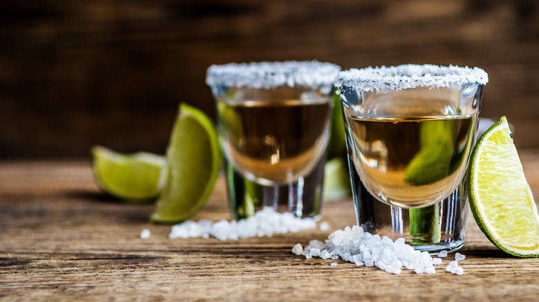 tequila shots with lime and salt on the rim