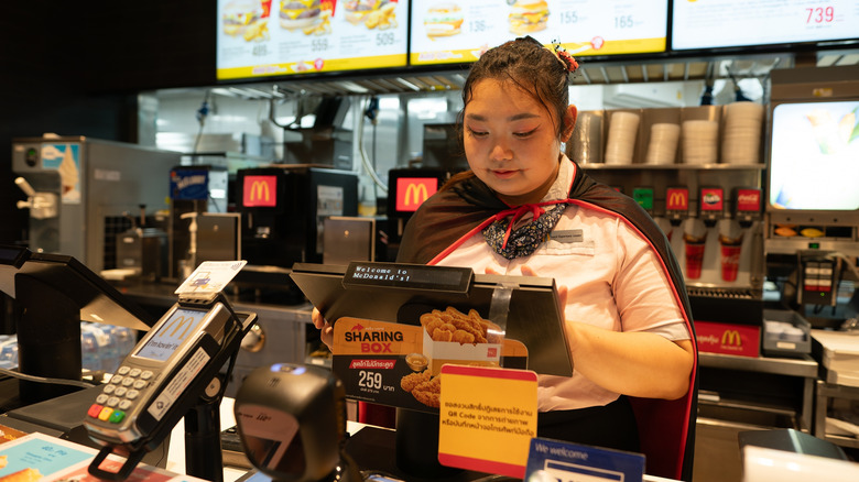 McDonald's worker taking order