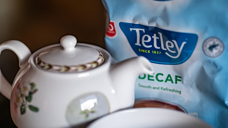 A teapot and bag of decaf tea