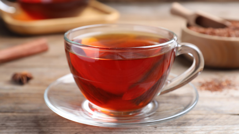 A glass cup of rooibos tea