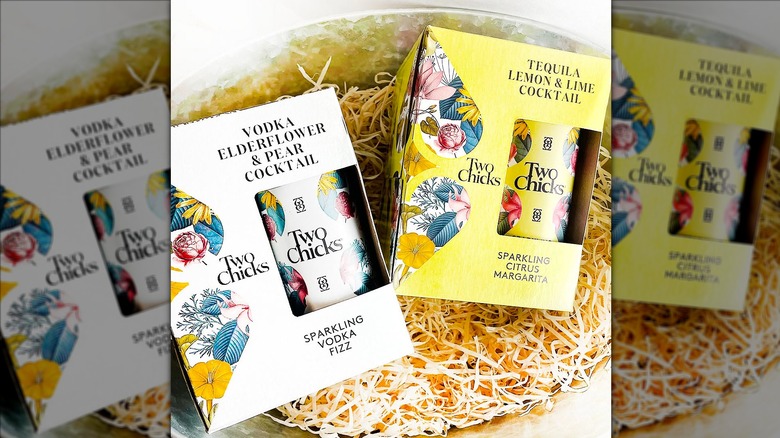 Two cases of Two Chicks cocktails in basket