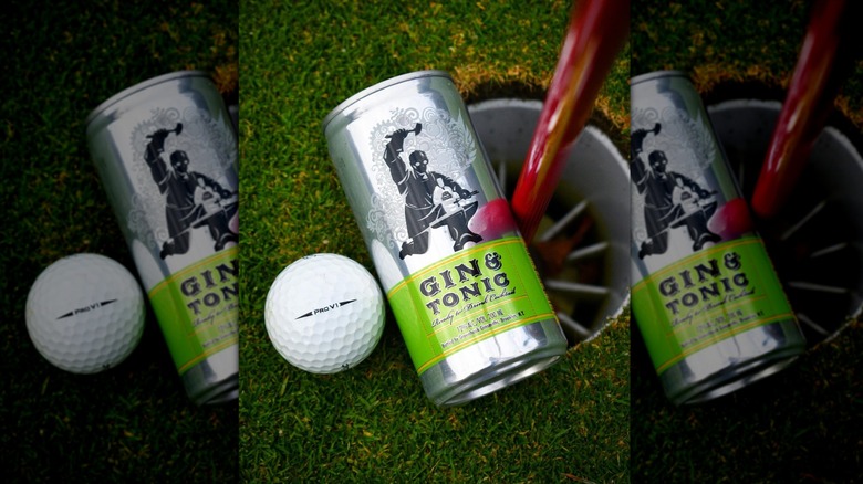 Can of Greenhook Ginsmiths gin and tonic next to golf ball