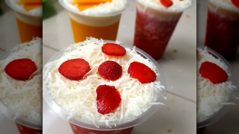Shelves of soft and whipped cheese in a supermarket