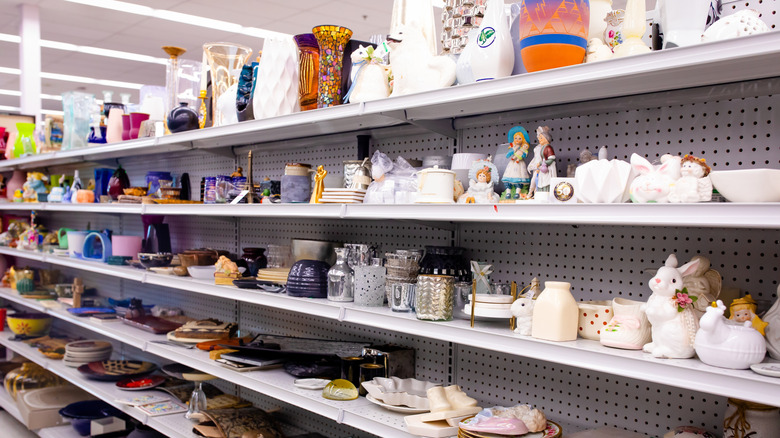 thrift store shelf full of vintage tableware