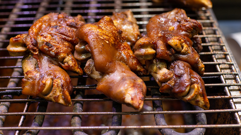 Roasted pig's feet on grill