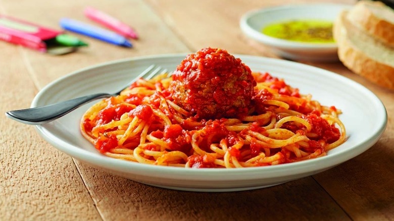 Plate of spaghetti with tomato sauce and single meatball from Carrabba's Italian Grill
