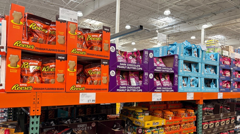 Display of Halloween candy inside Costco store, including Reese's and M&Ms