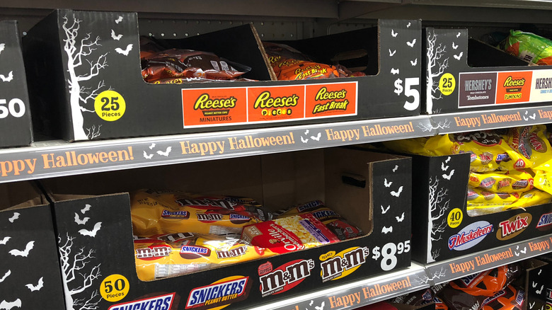 Black cardboard boxes of candy inside Dollar General