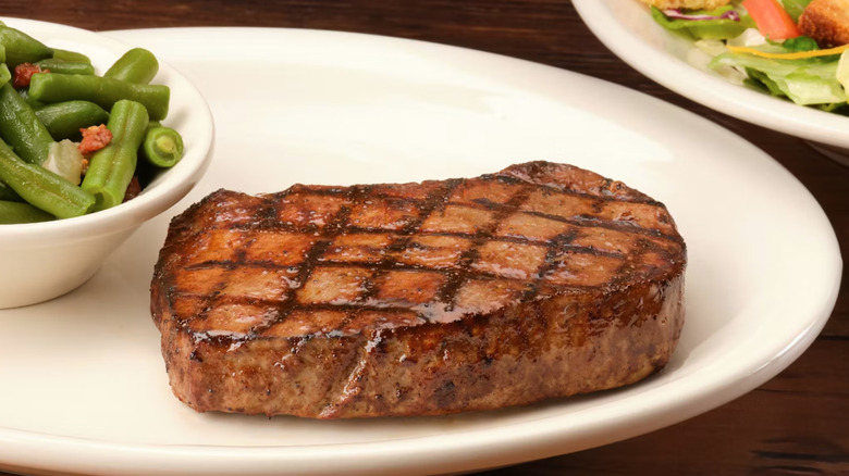 Texas Roadhouse 6-ounce hand cut sirloin on plate.