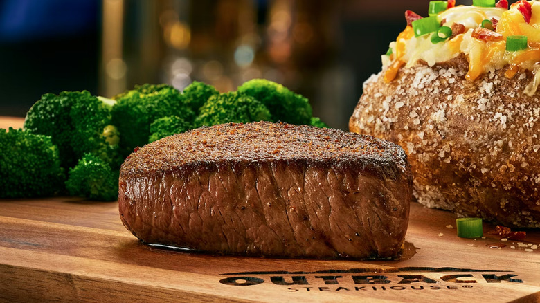 Outback Steakhouse 6-ounce center cut sirloin on wood cutting board.