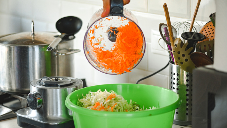 chopped veggies in a food processor and bowl
