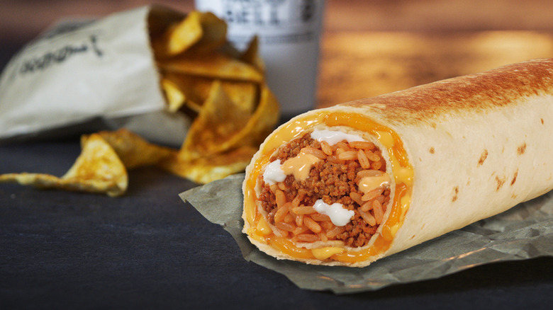A Quesarito filled with ground beef, rice, cheese, and sour cream