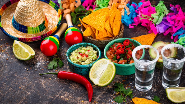 Red and green salsas with tortilla chips at a Mexican restaurant