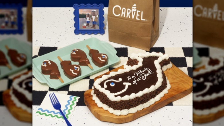 Carvel Fudgie the Whale cake, popsicles, bag on table