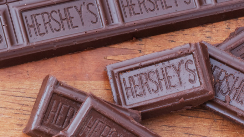 Hershey's bar and pieces on wood table
