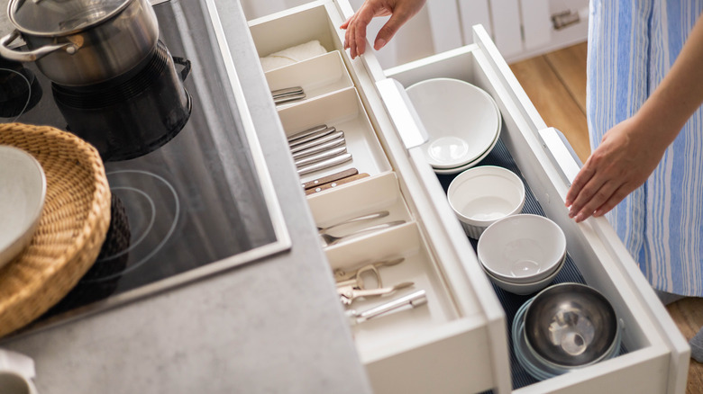 dishes and utensils in kitchen drawers