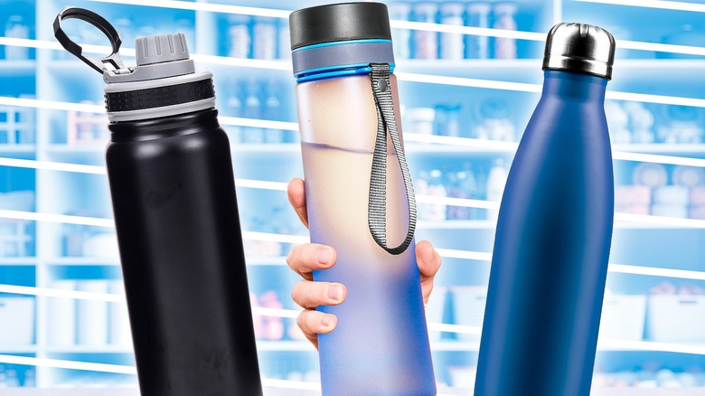 Three reusable water bottles with pantry shelves in the background