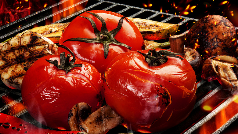 tomatoes cooking on a grill