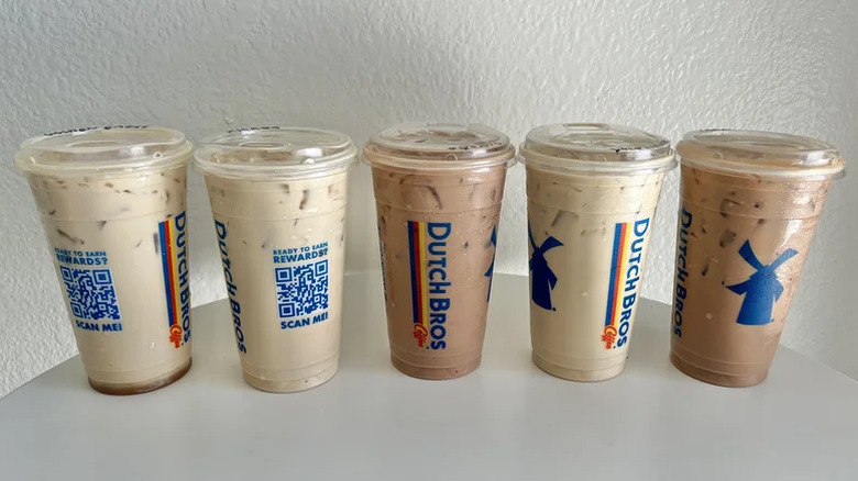 Multiple Dutch Bros. iced coffee drinks in a row