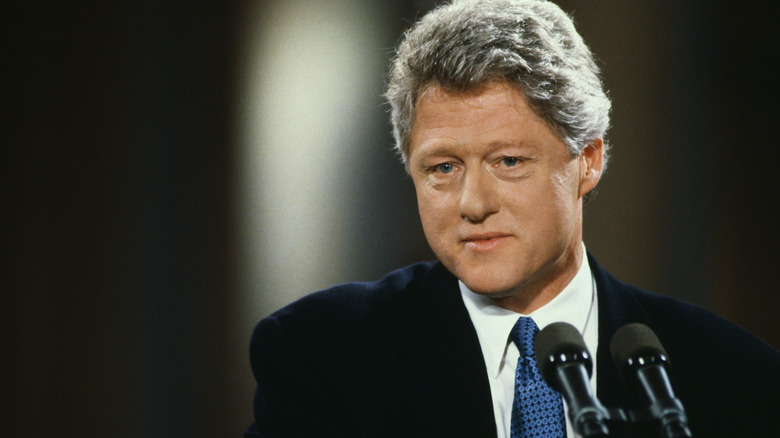Bill Clinton in front of blurred background