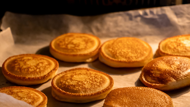 Pancakes on a parchment paper covered sheet pan
