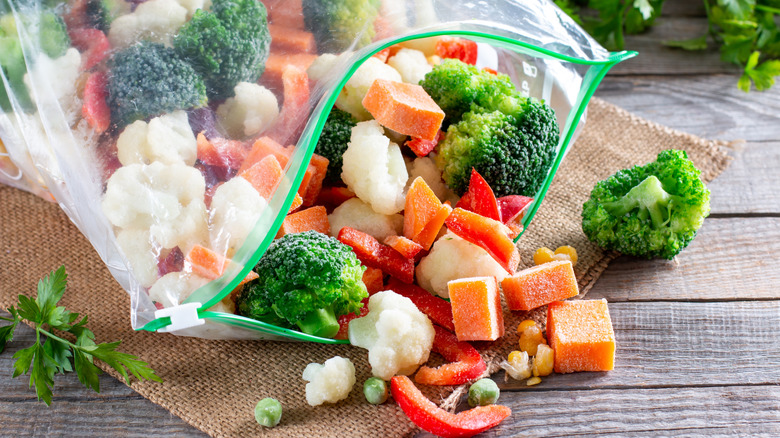bag of mixed frozen vegetables spilling onto table