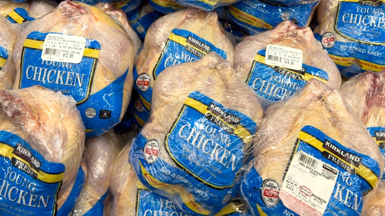Costco Kirkland Signature whole young chickens wrapped in plastic and arranged in a pile