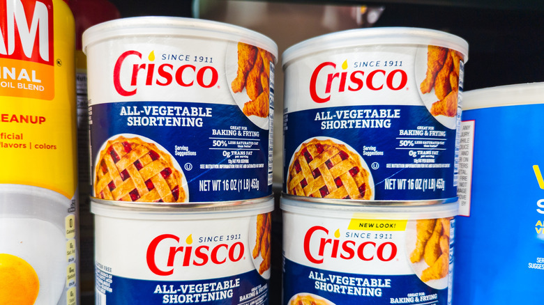 Tubs of Crisco vegetable shortening on grocery store shelf