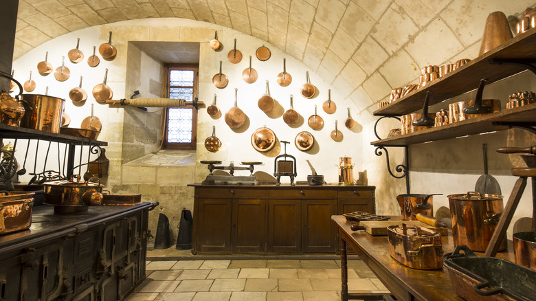 antiquated french kitchen with copper pots