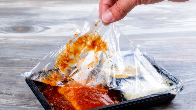 removing plastic from frozen meal